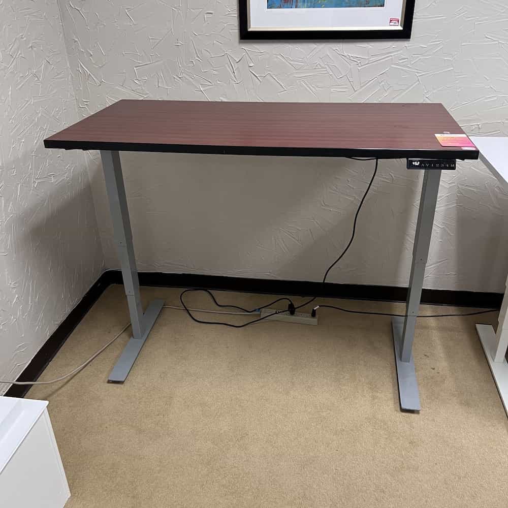 cherry and black desk top with silver base, electric