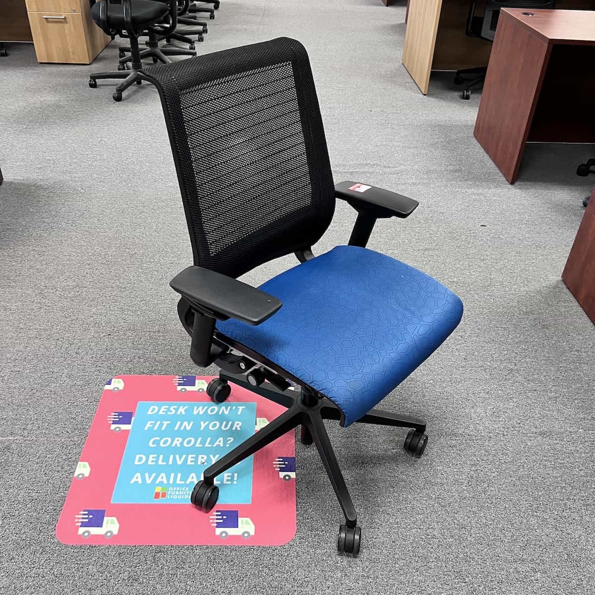 blue and black steelcase think office chair