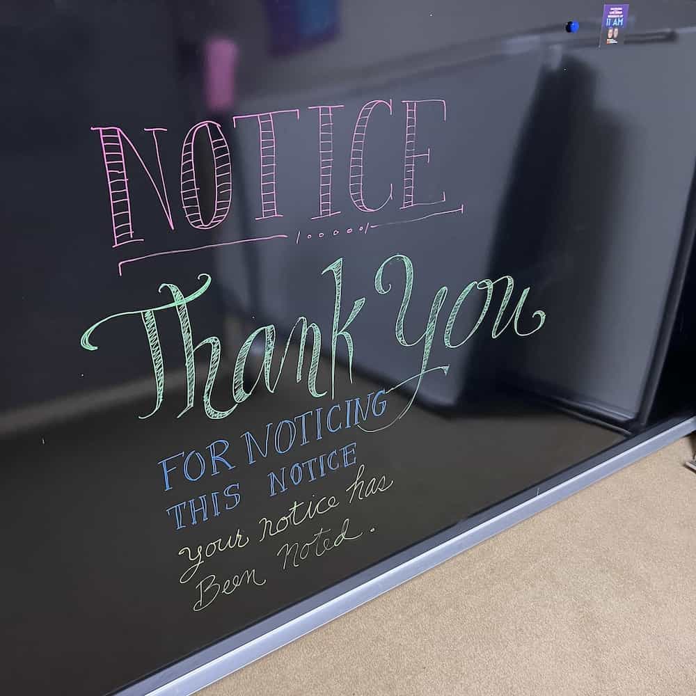 black wet erase board with the words "notice. Thank you for noticing this notice. Your notice has been noted."
