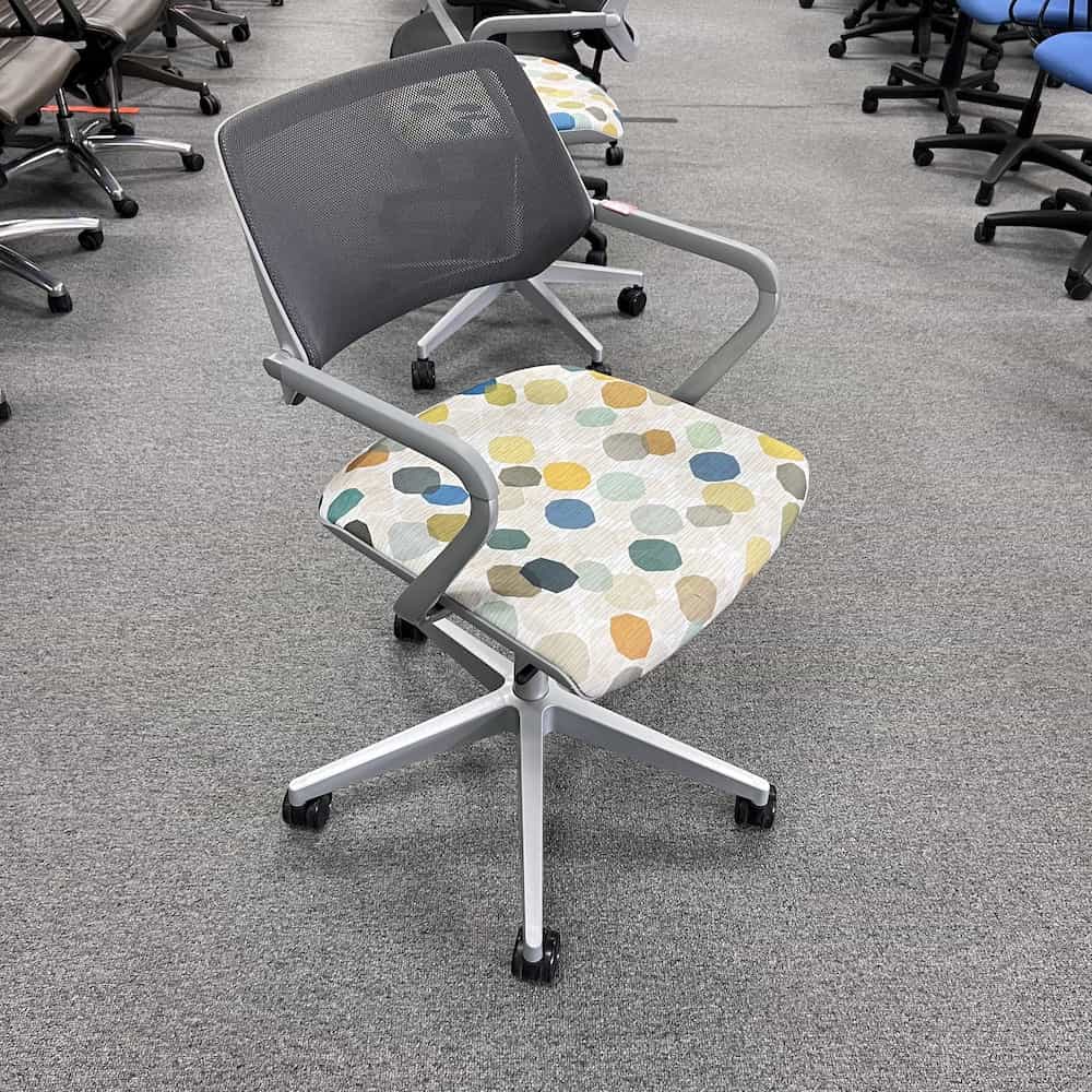 grey and multi color on white dots rolling office chair used steelcase