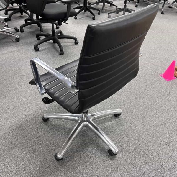 black and chrome mid back rolling conference chair
