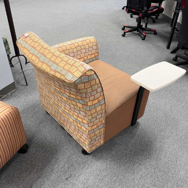 upholstered chair with square base and back, swivel table right side, arm on left, back