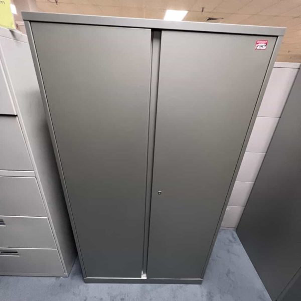 grey metal storage cabinet with shelves