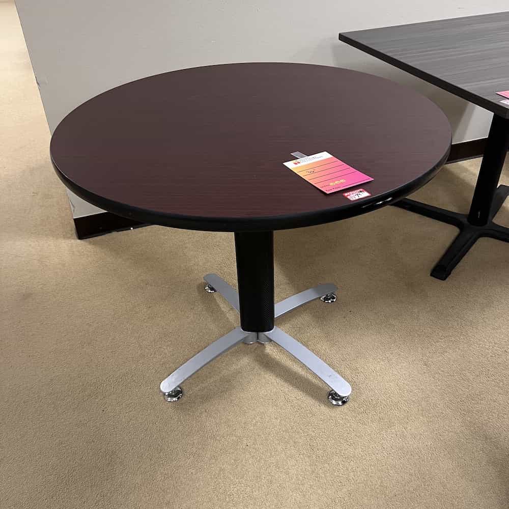 mahogany round laminate table top with black and silver base