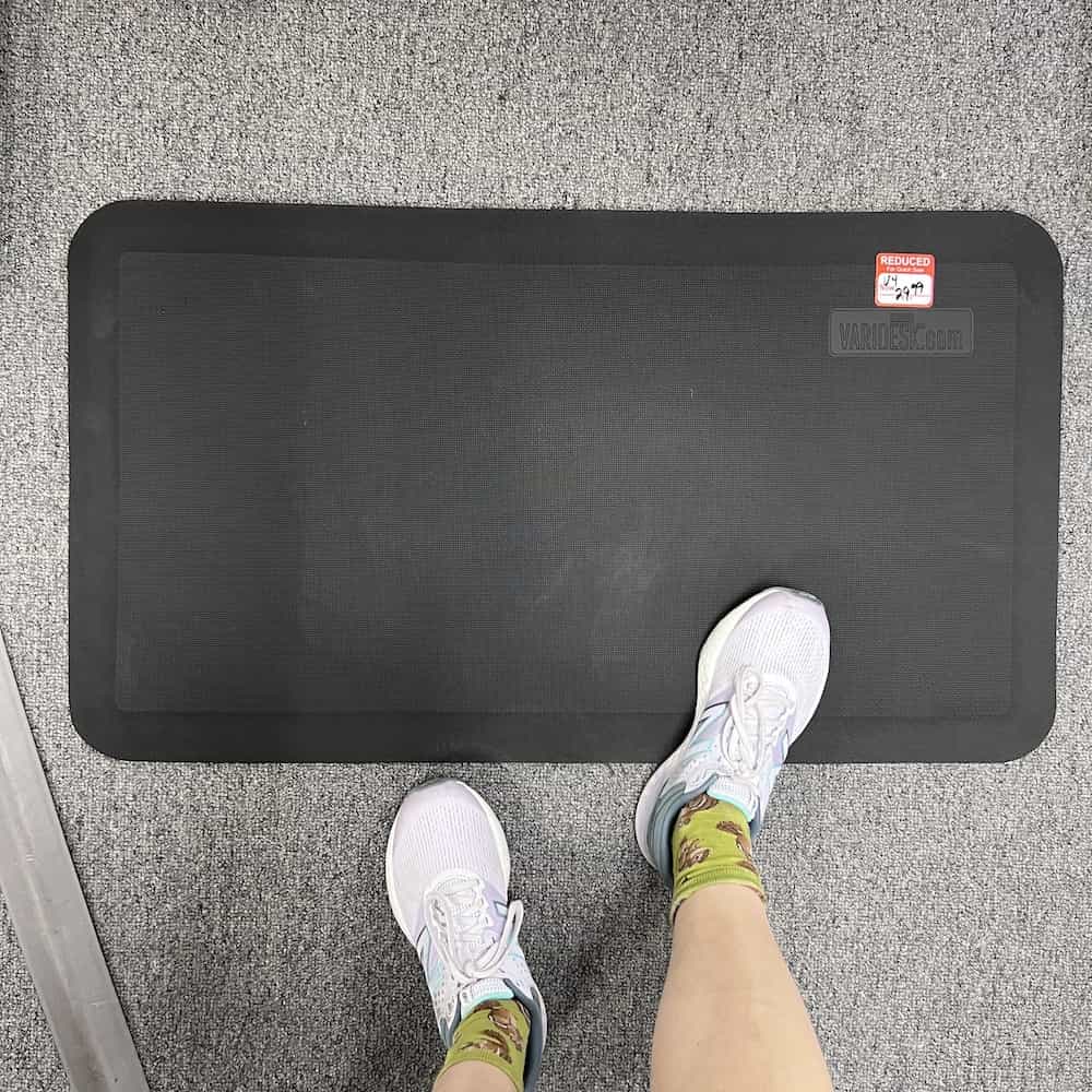 Anti-Fatigue Floor Mat for Standing Desks, pictured with feet