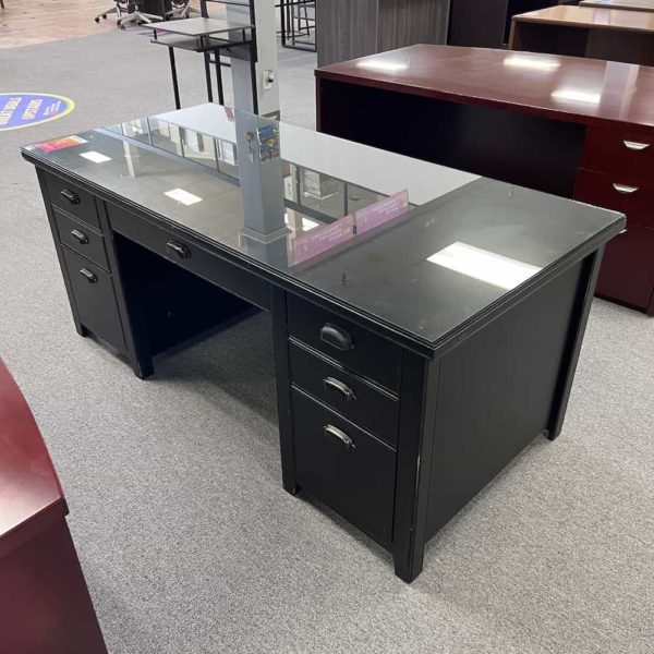 black desk with glass top and box box file drawers and center keyboard drawer