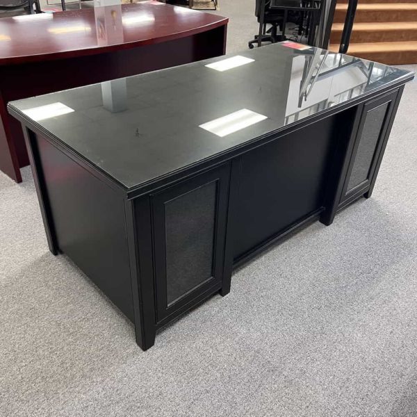 black desk with glass top and two glass cabinets on either side