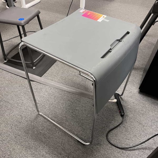 small grey desk with wire frame, side