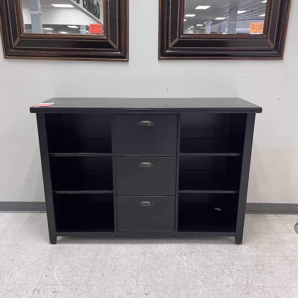 black credenza with 3 legal drawers in the center, and a bookcase on each side