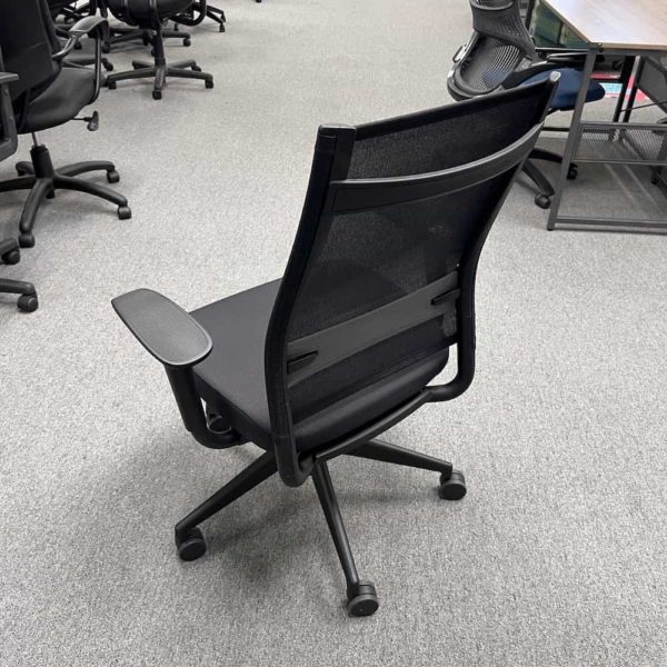 black office chair, back view, mesh back