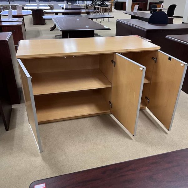 open doors, maple cabinet credenza with three doors, silver trimming. modern