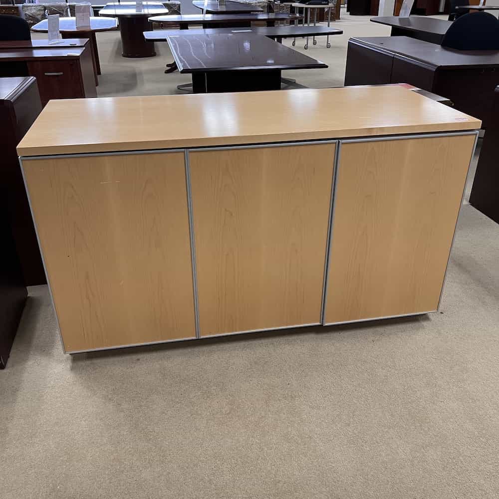front, closed doors, maple cabinet credenza with three doors, silver trimming. modern