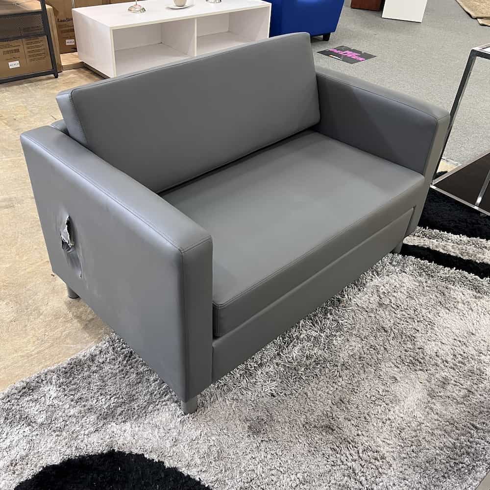 grey vinyl boxy sofa loveseat modern sleek, hole on the right side