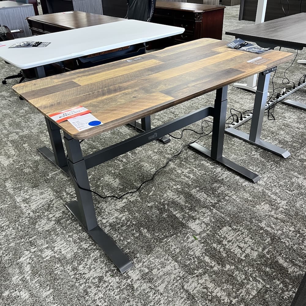 wood look laminae with grey legs, vari height adjustable desk, used office furniture, open box