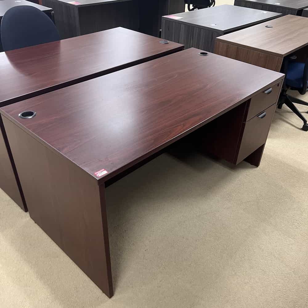 mahogany desk with black pulls, hanging file on right side
