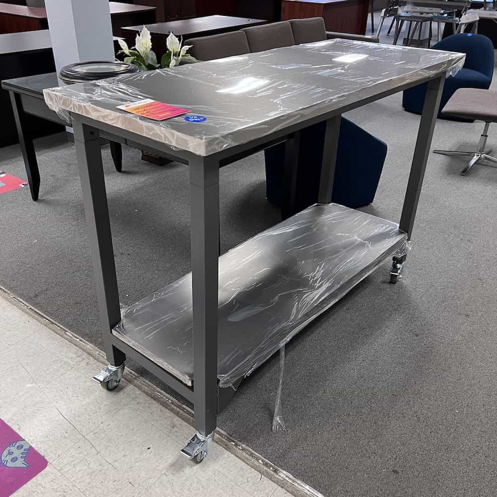silver stainless steel rolling work table