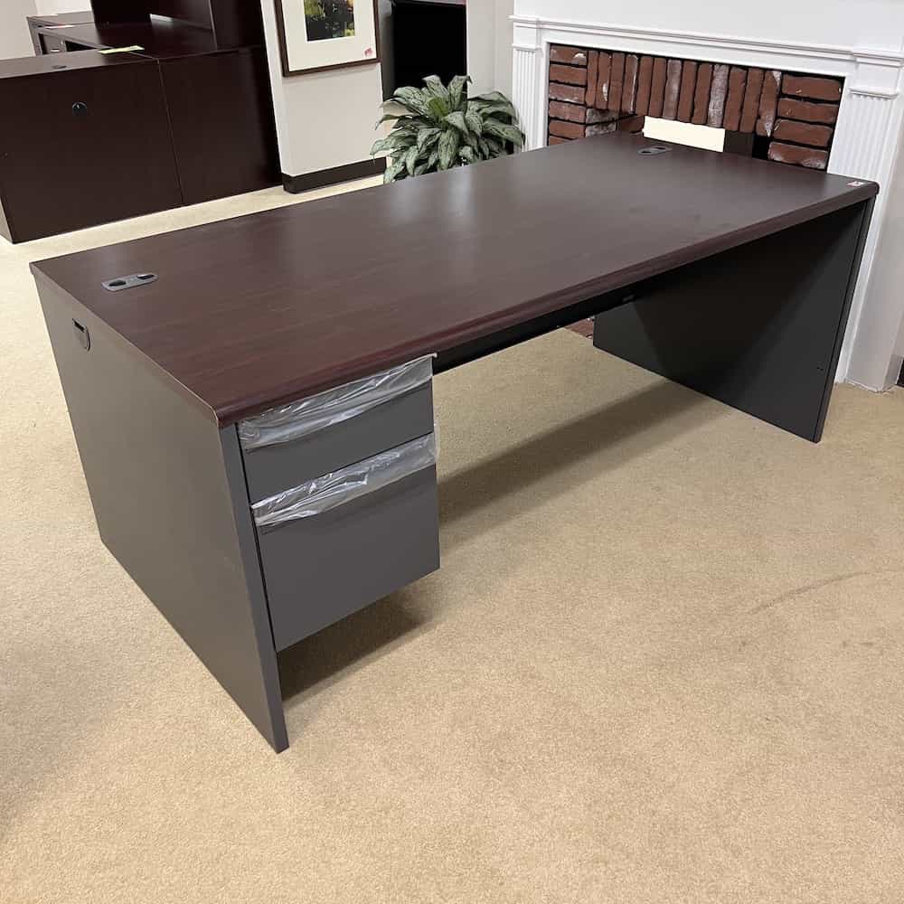grey and mahogany desk with one hanging file