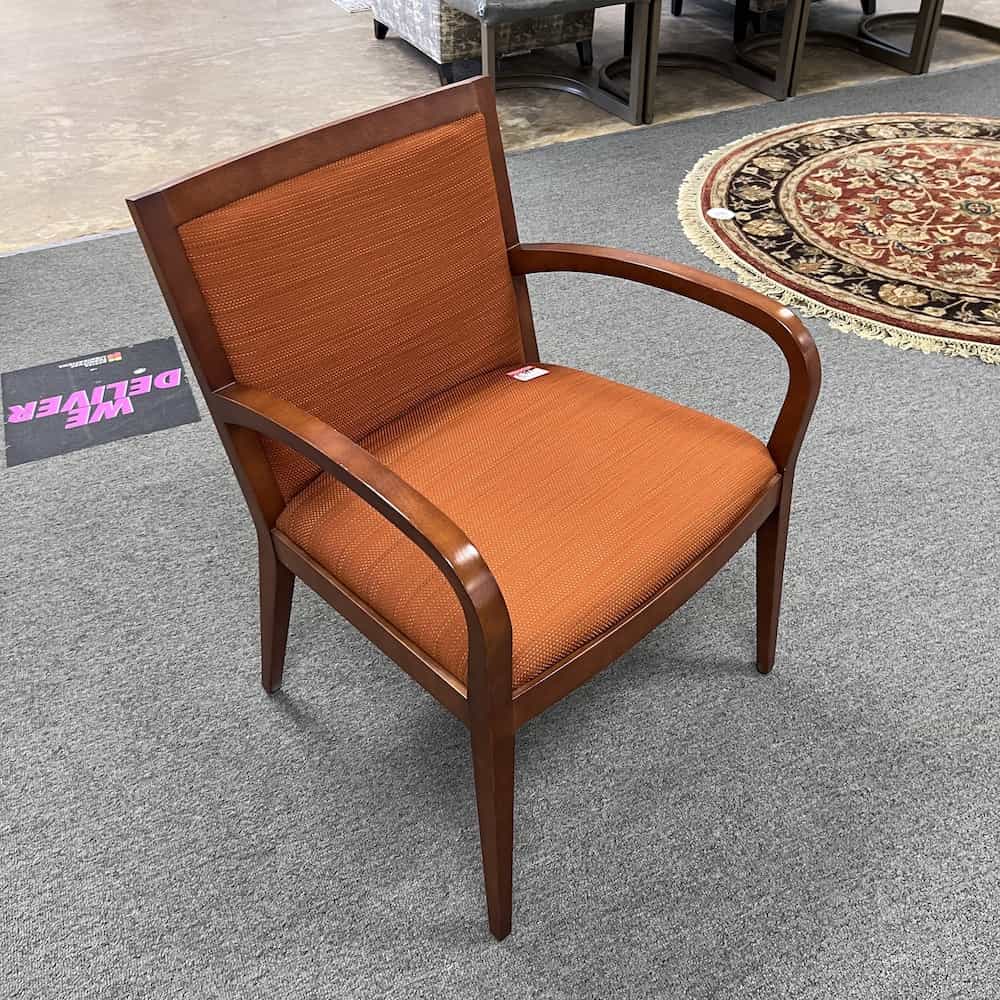 orange guest chair with cherry veneer