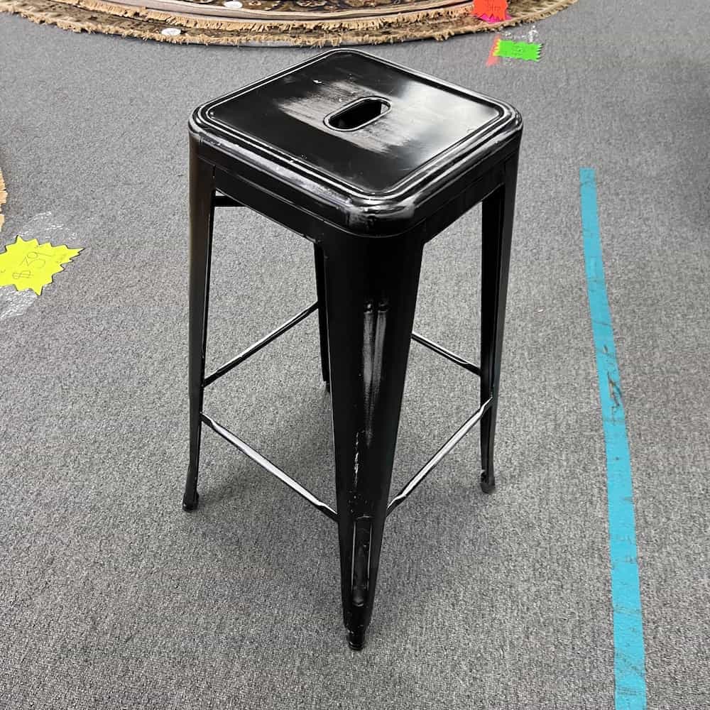 black distressed metal stool