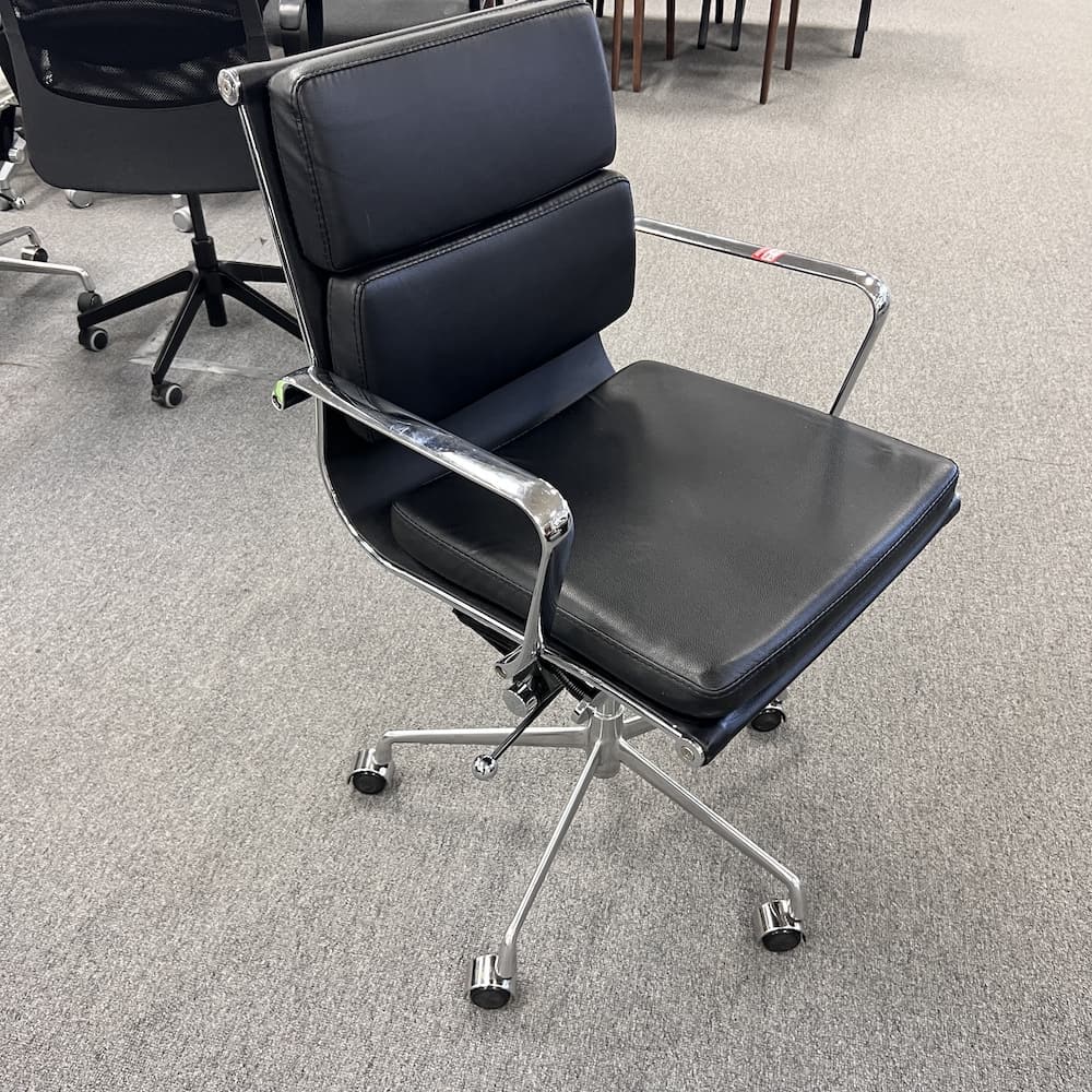black padded vinyl with chrome base conference chair, used office furniture