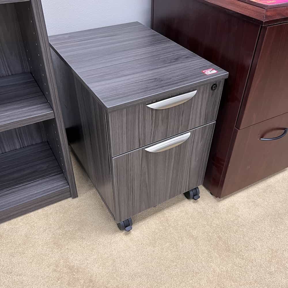 grey laminate box/file cabinet with finished top and wheels.