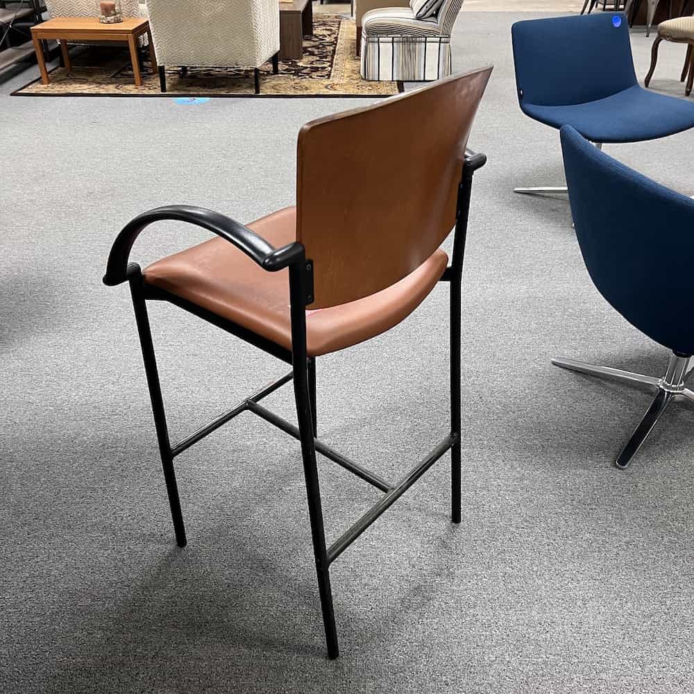 tan and black bar height stool with wood back and vinyl seat