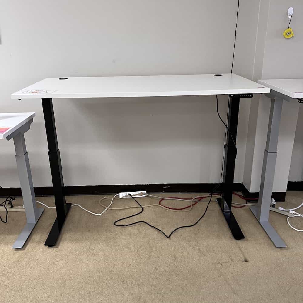 white top height adjustable desk with black metal base
