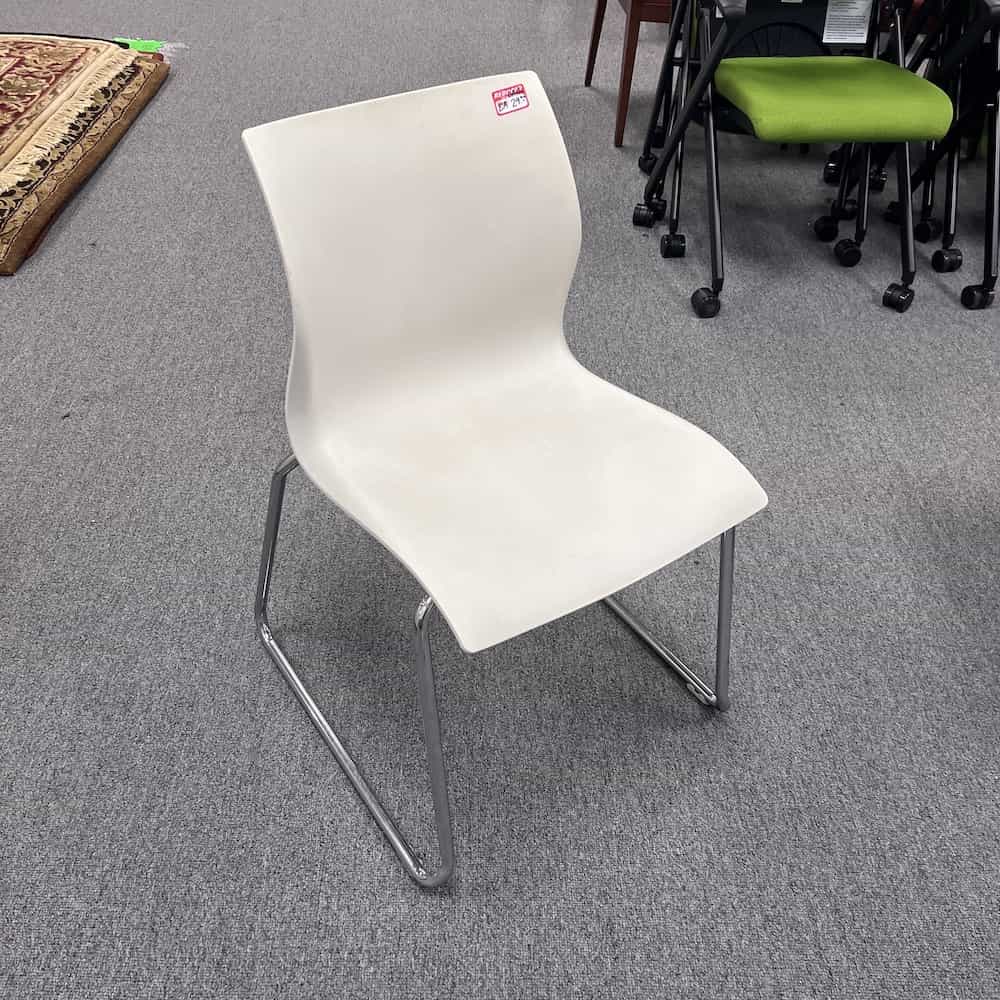 white stacking chair teknion chrome