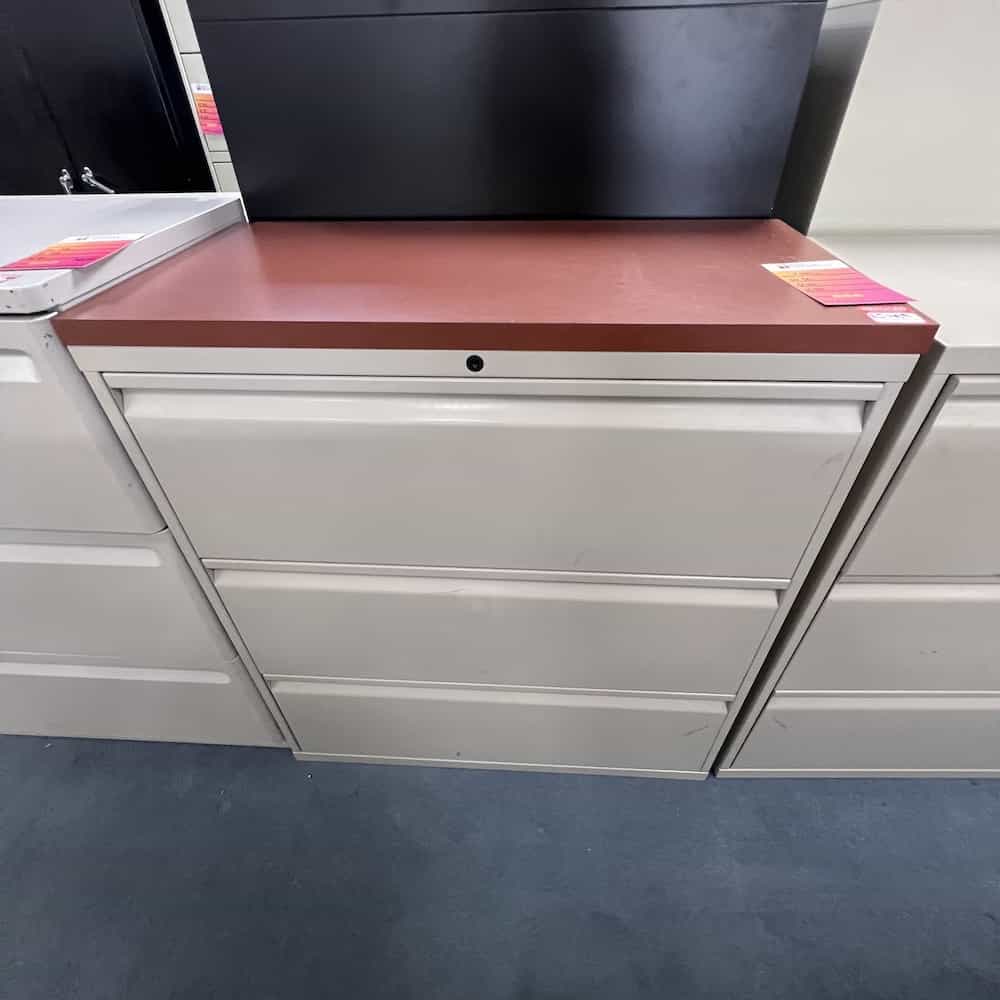 cherry laminate top on a 3 drawer lateral metal file, knoll brand
