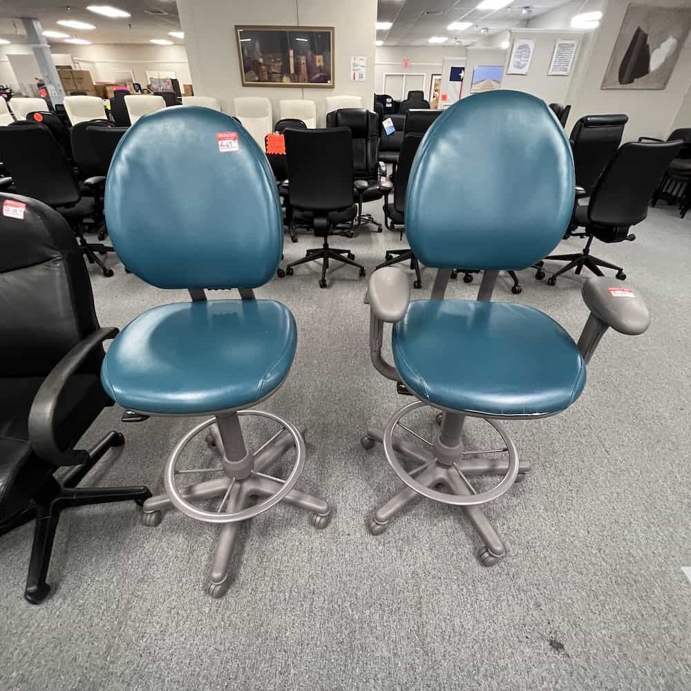 teal office stool drafting stool, one on left without arms, one on right with arms