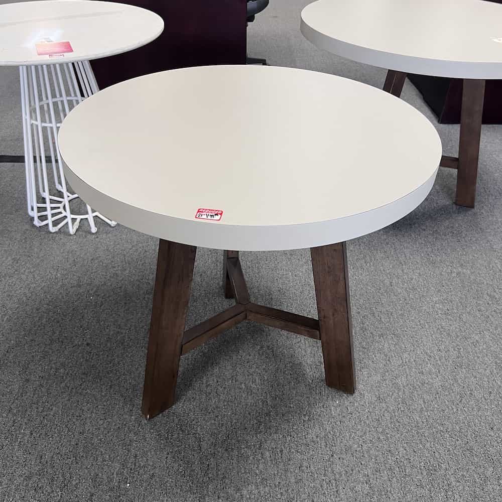 tan laminate round table with walnut wood base