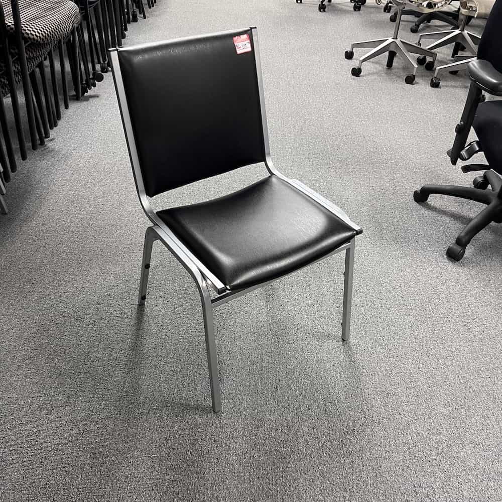black and silver stacking chair