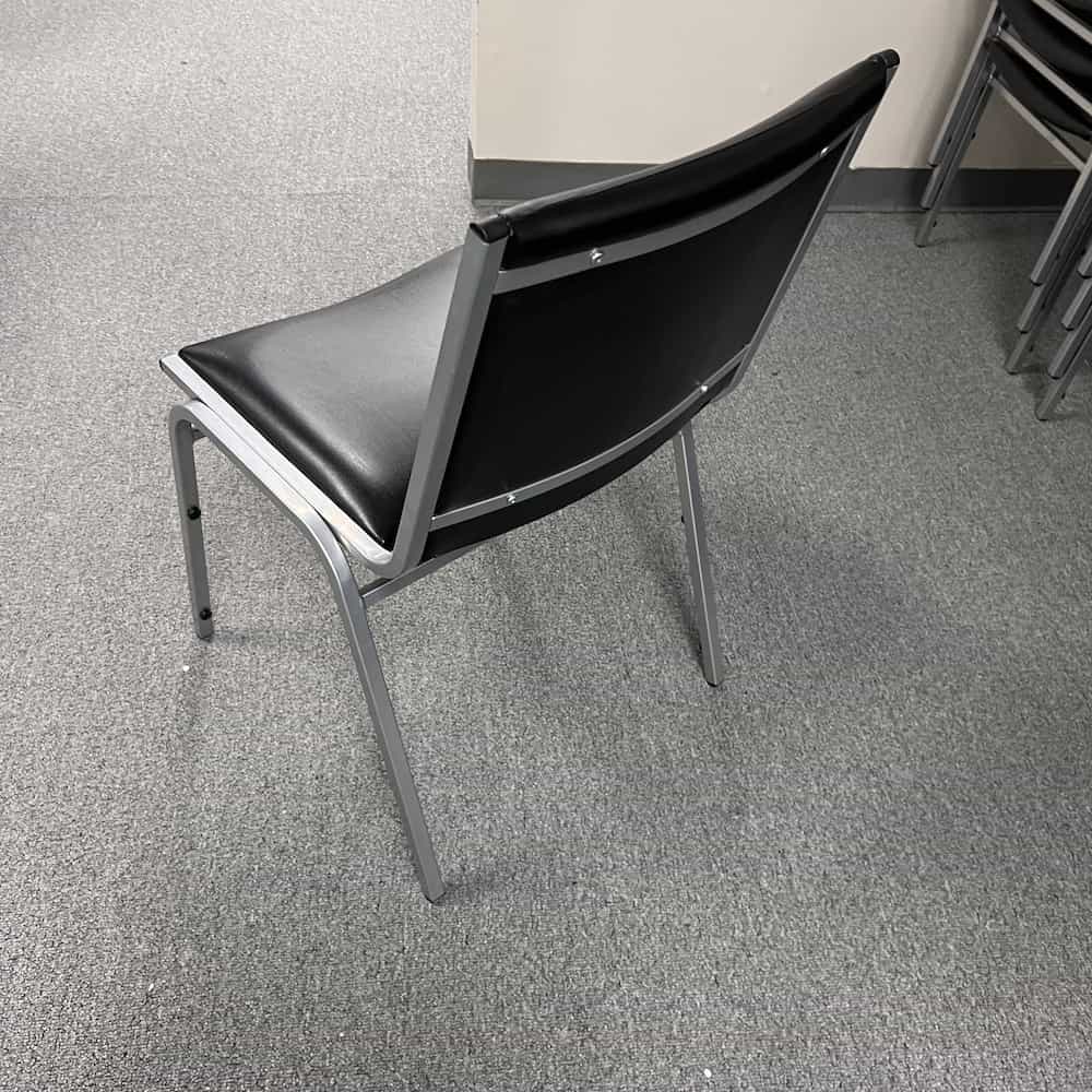 black and silver stacking chair