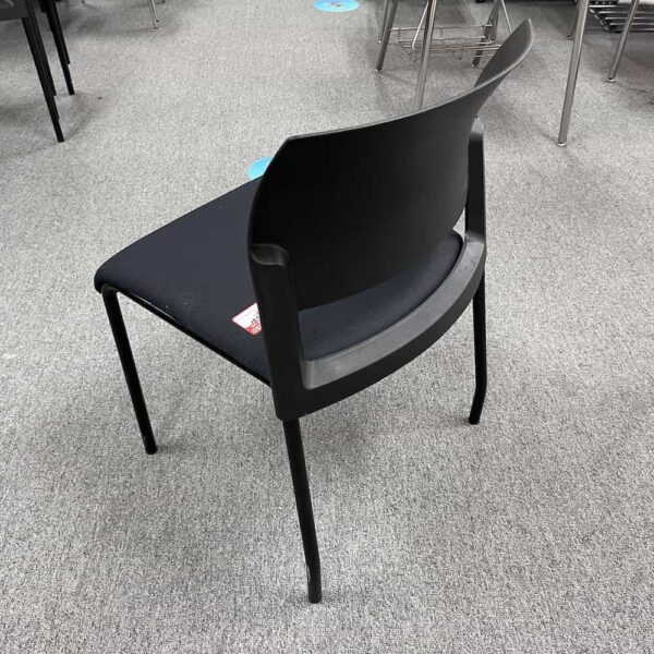 black steelcase move stacking chair with upholstered seat