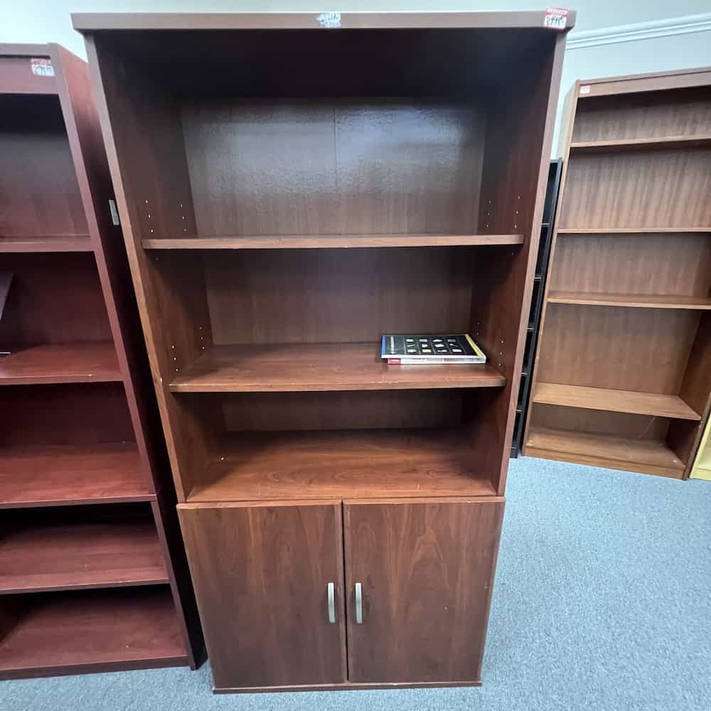 cherry paperboard bookcase with 2 door storage cabinet base