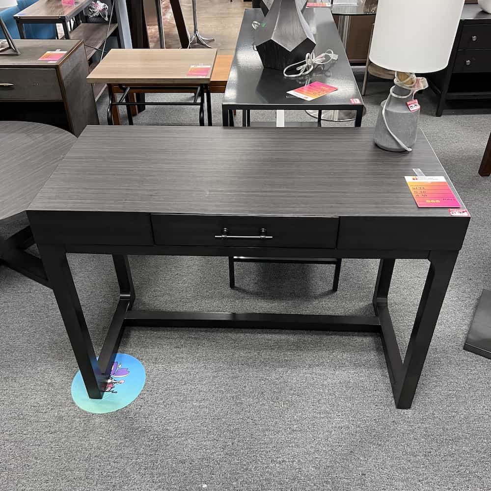 dark grey writing desk with one drawer