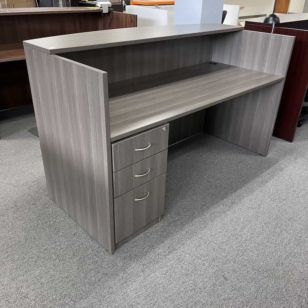 grey reception desk with one BBF, laminate transaction top