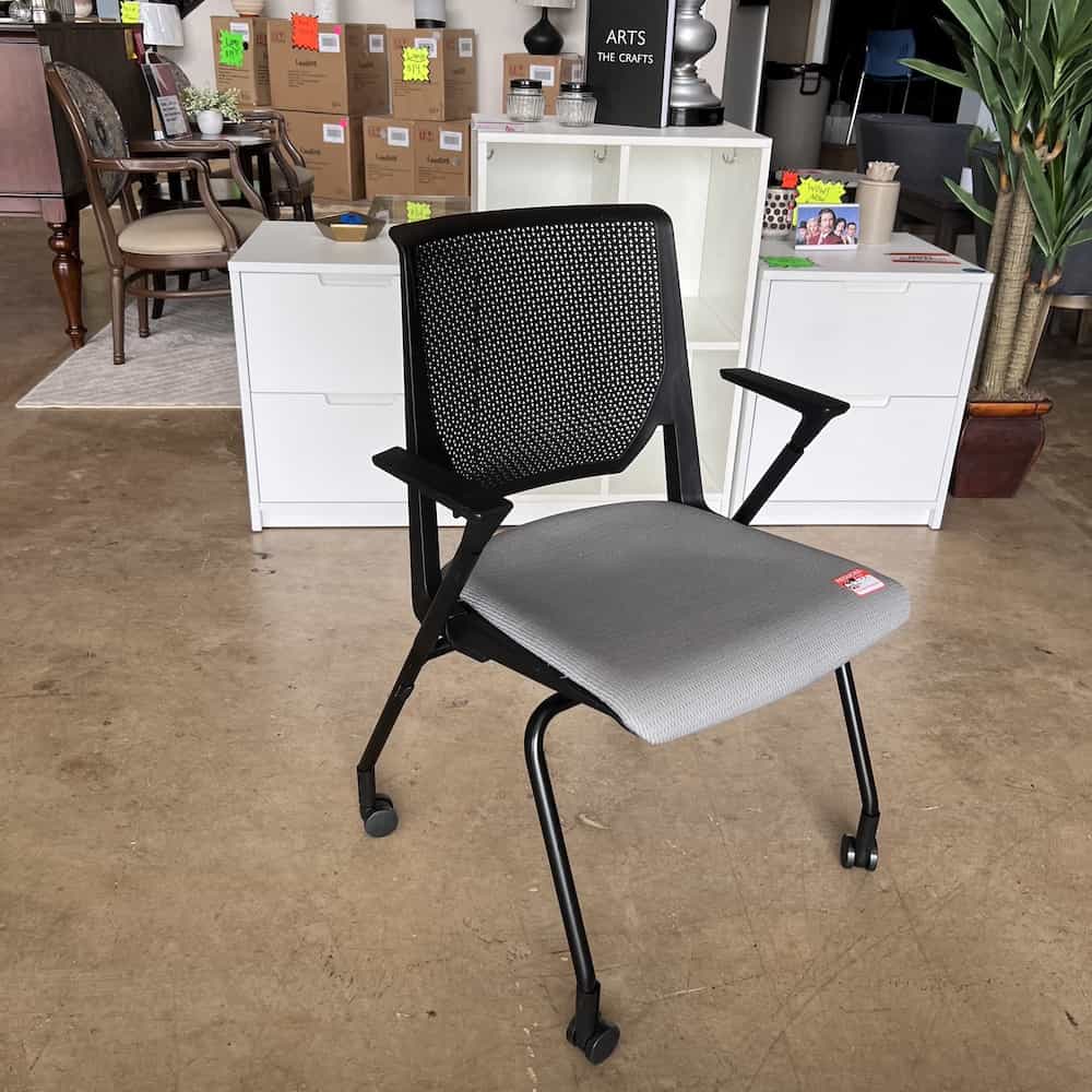 black plastic back and frame, grey upholstered seat haworth very seminar stacking chair