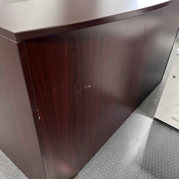 mahogany scratched front of reception desk