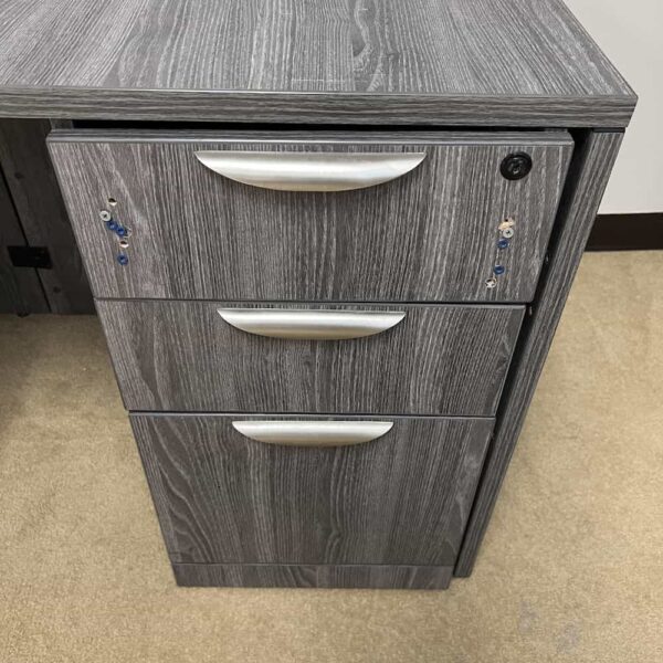 grey l-desk with bullet nose, right return, box box file detail of screws in the front