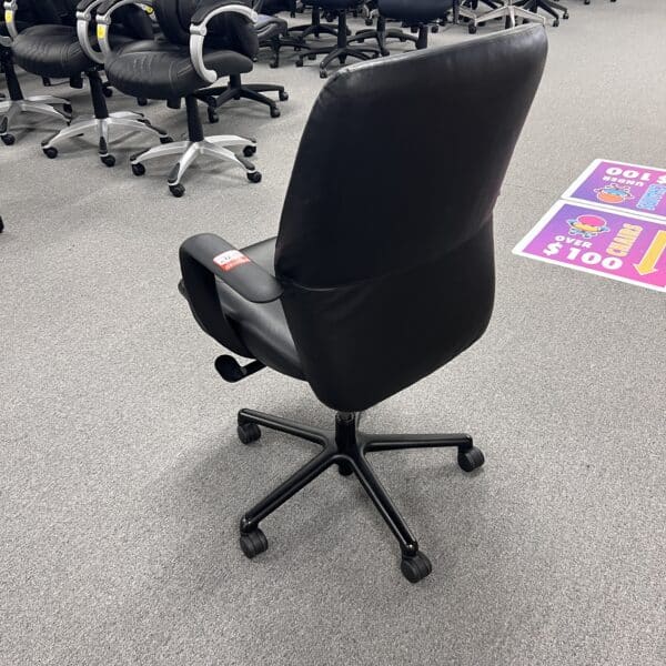 black leather conference chair with fixed arms