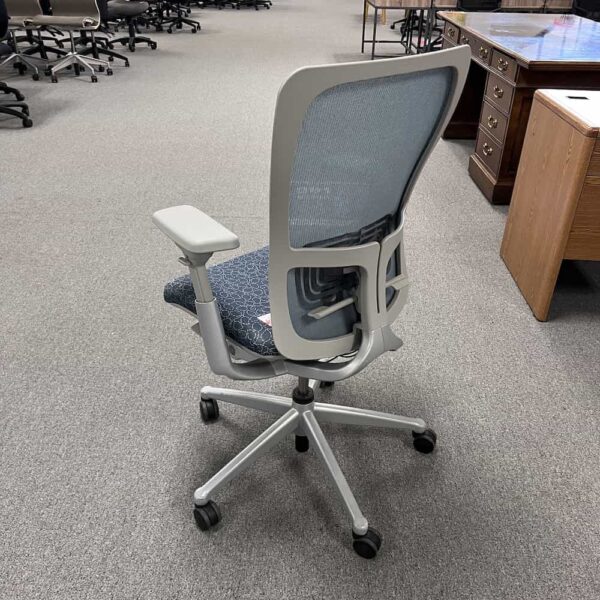 blue and grey zody haworth office chair, back view