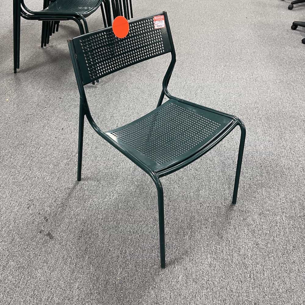green metal stacking chair, back