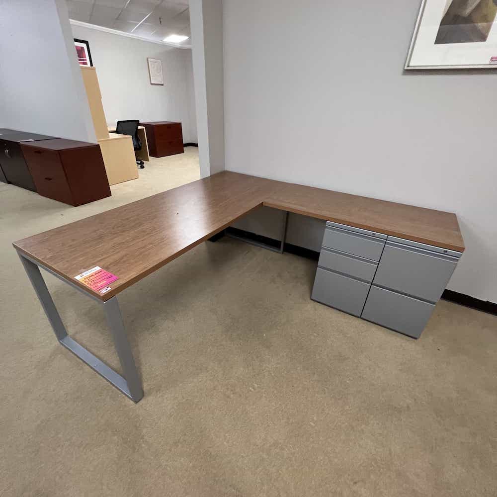 herman miller l-desk, walnut table with right return, and a silver metal combo file cabinet
