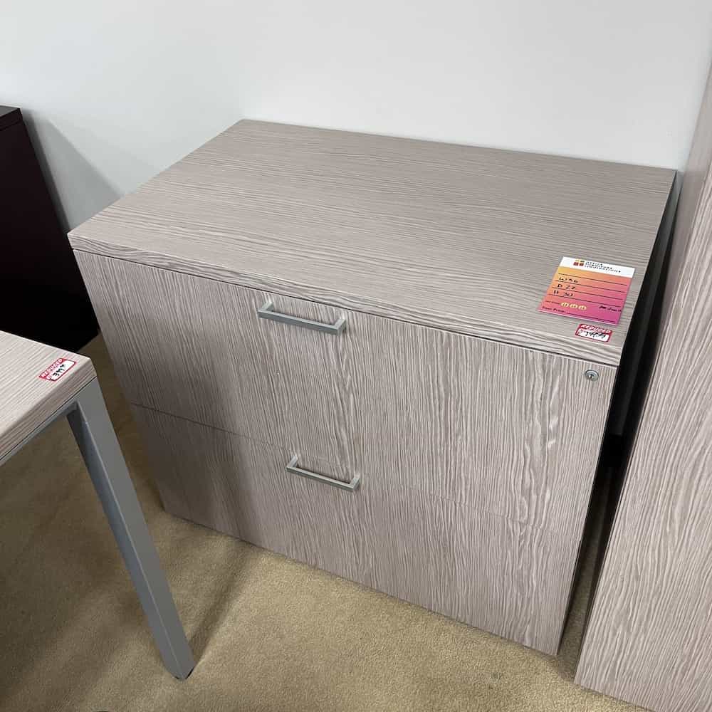 weathered grey taupe woodgrain laminate with silver pulls. 2 drawer lateral
