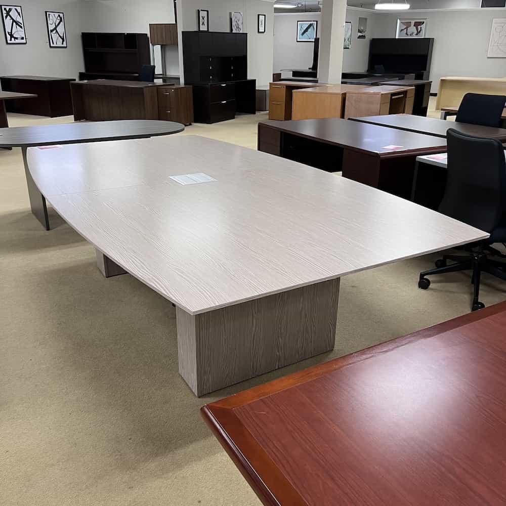 boat shaped conference table in light grey weathered wood with center port