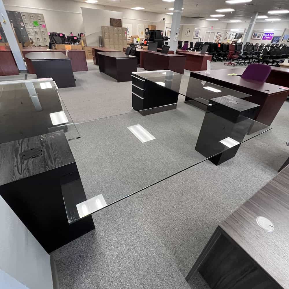 black, silver, and glass U-desk, with 2 box/box/file pedestals, a glass floating top, back view