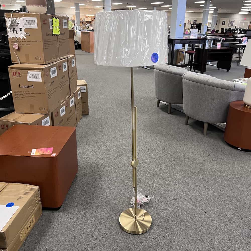 gold floor lamp with white lamp shade