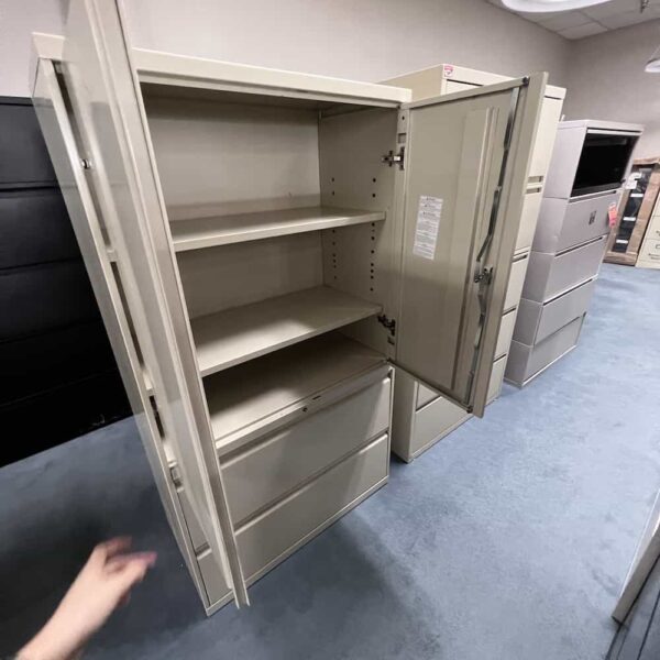 light tan metal 2 door cabinet with 2 drawer lateral, open doors