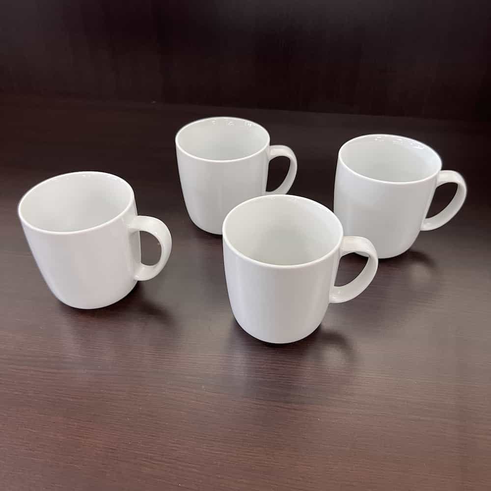 4 white ceramic mugs